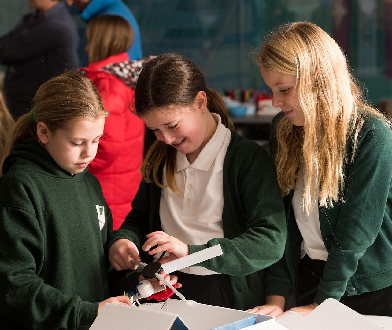 Schoolchildren Learning to make wind turbines.