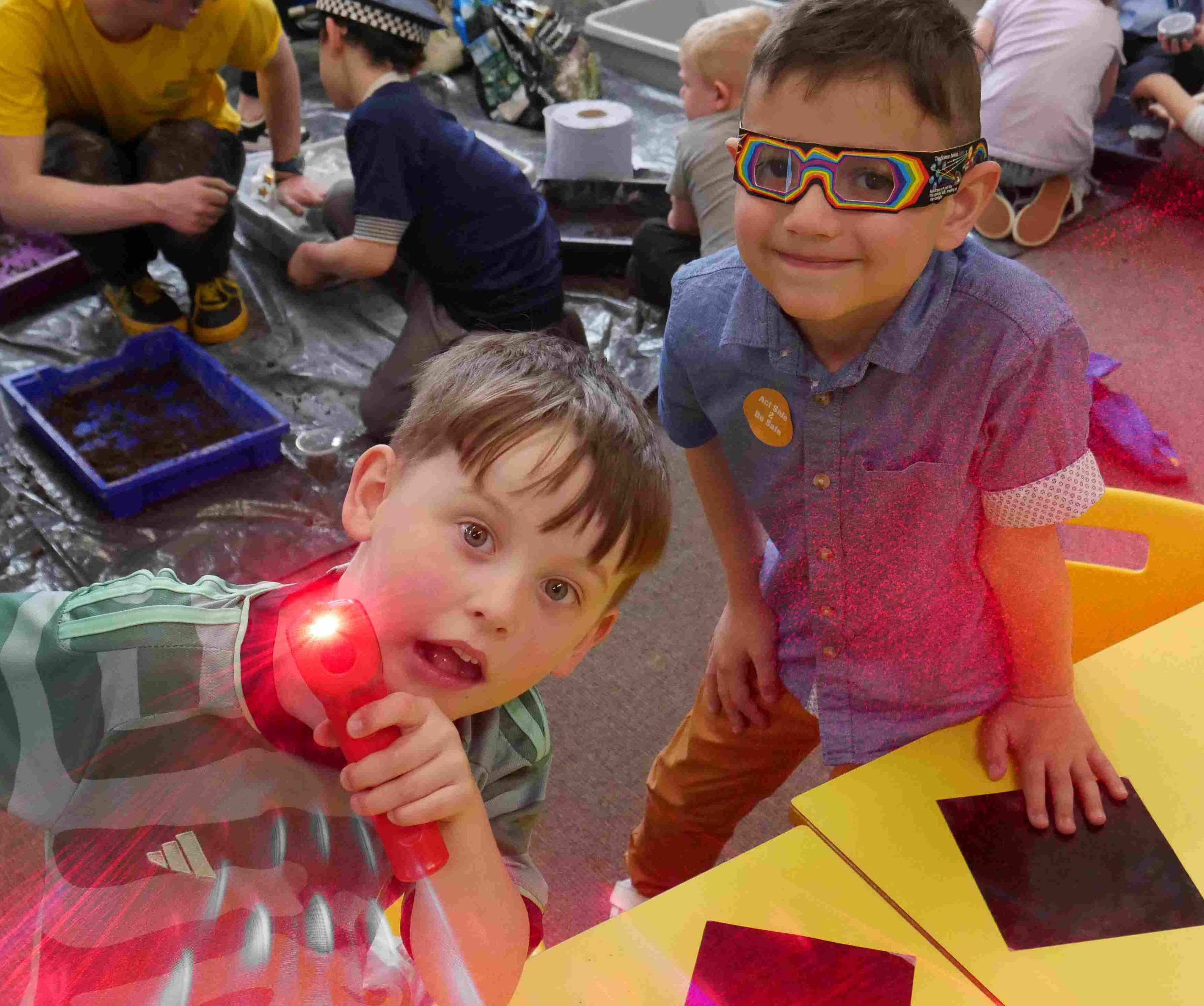 Young boys playing with lasers