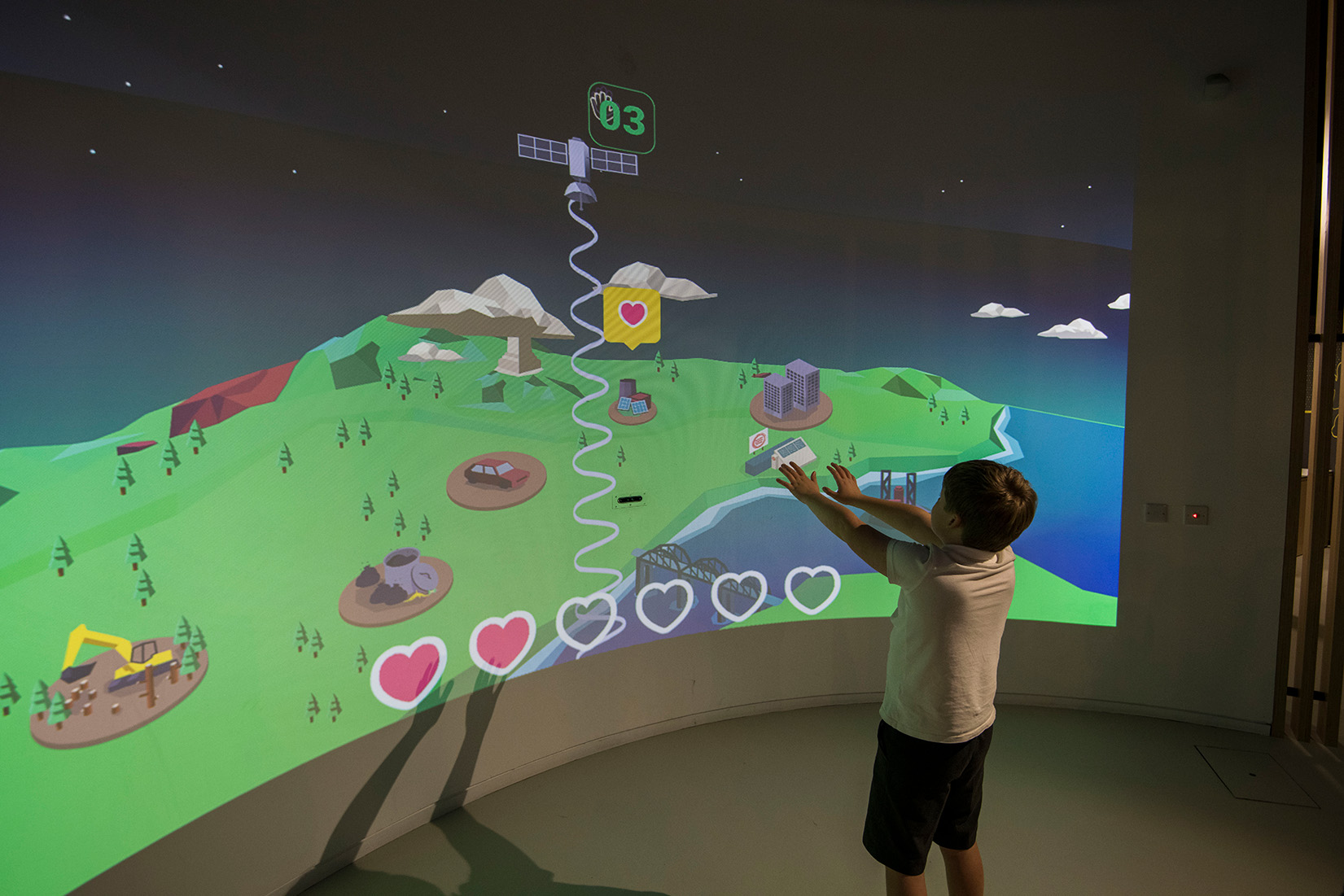 child playing with sustainability game